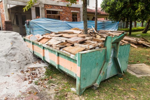Construction waste being cleared from a building site in Swiss Cottage