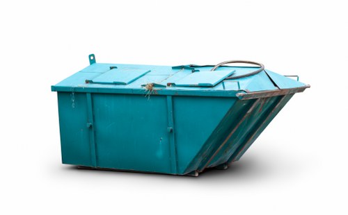 Skip hire truck and safety cones at site