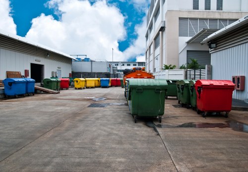 Professional demolition waste removal team at a Swiss Cottage site