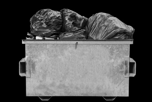 Workers loading a van during a flat clearance